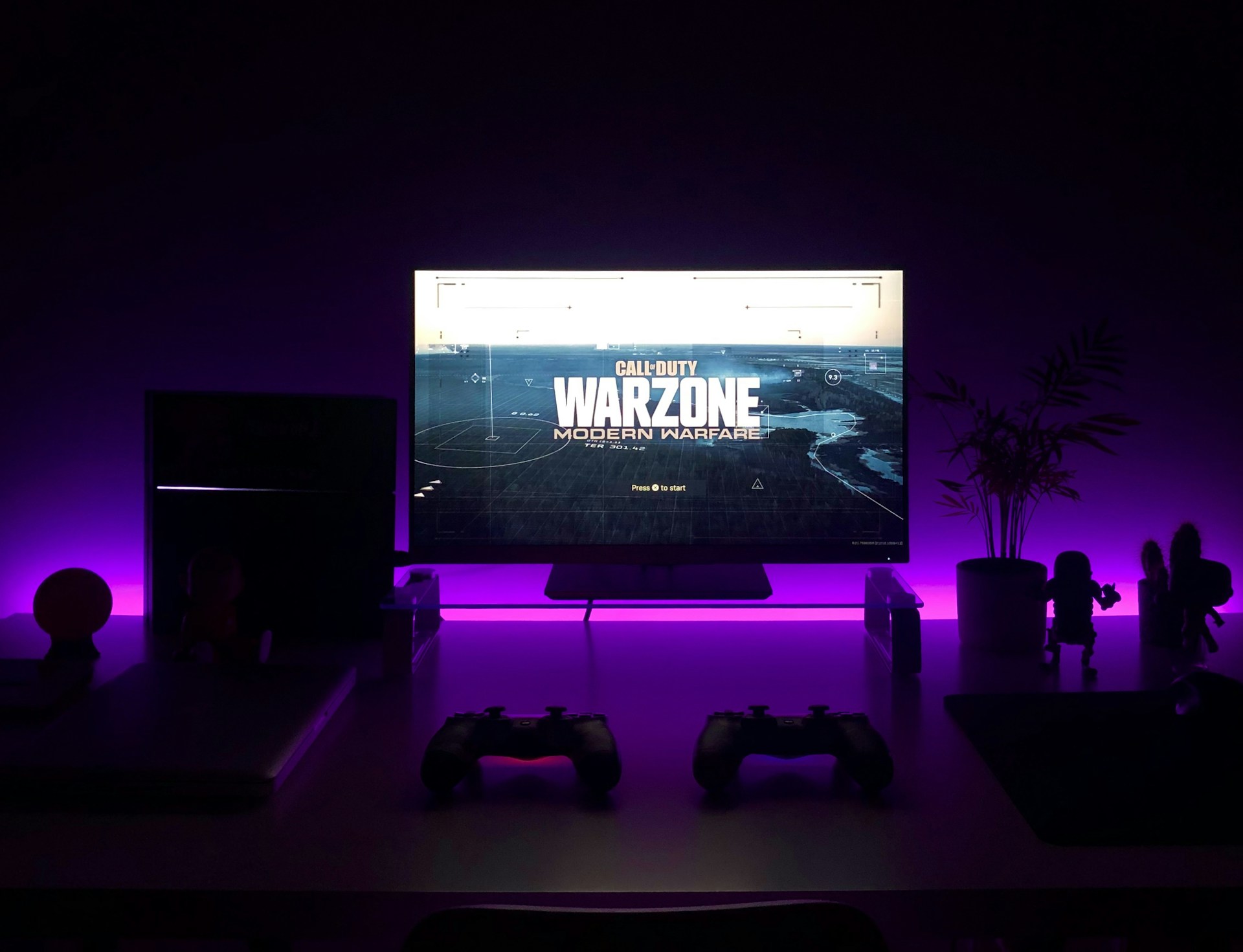 Dark atmospheric gaming setup with RGB lighting