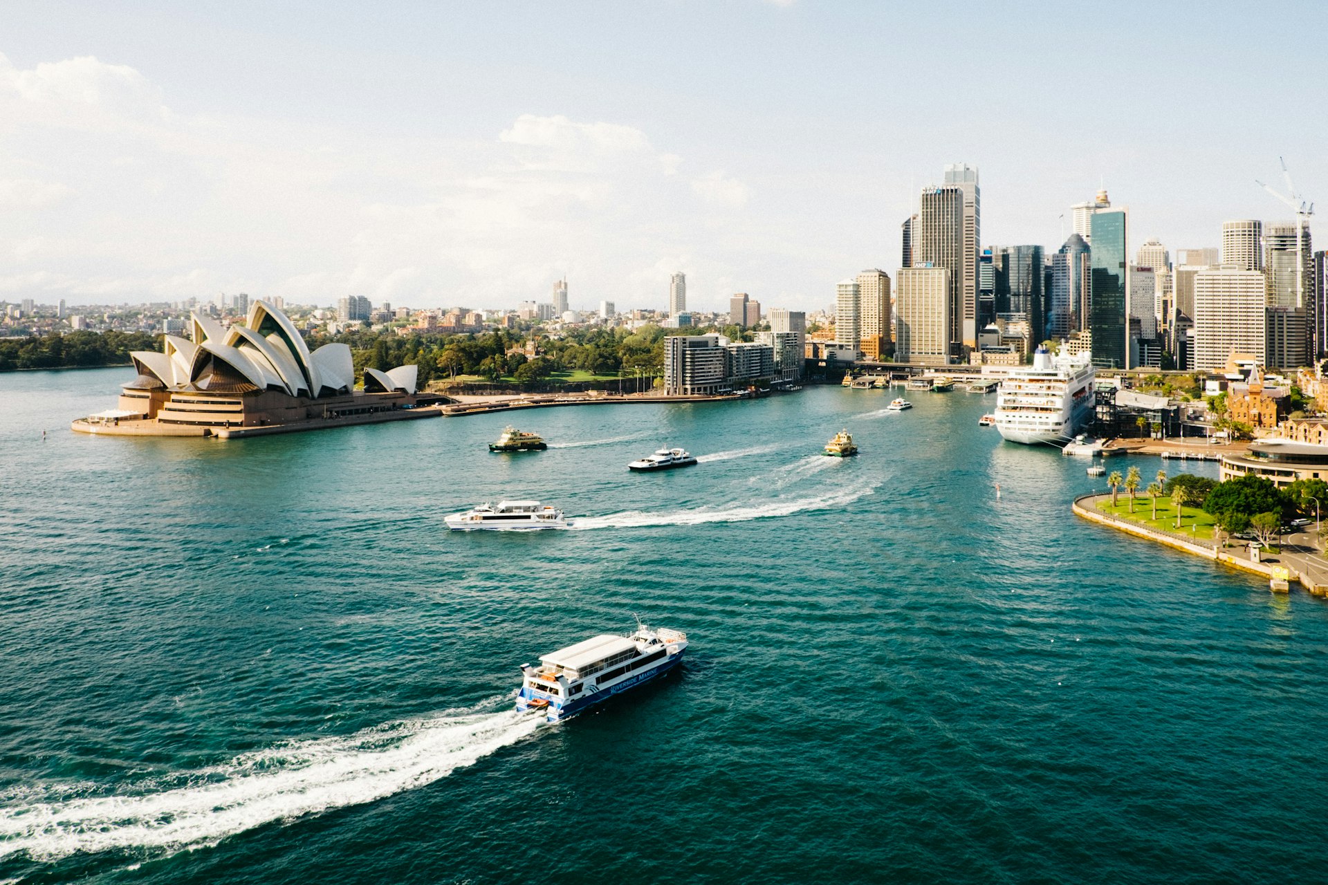 Sydney Harbour with the iconic Opera House and city skyline at golden hour