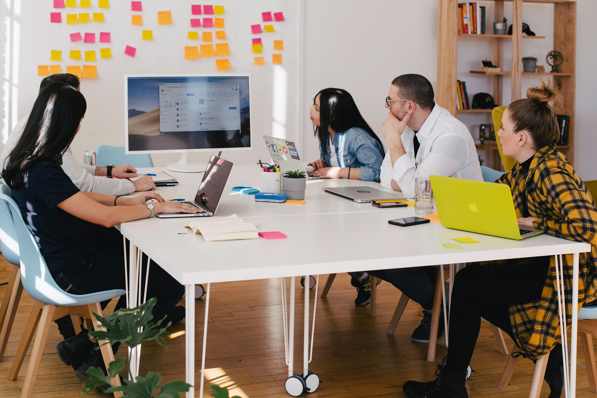 Business team reviewing voice AI call results on computer screens