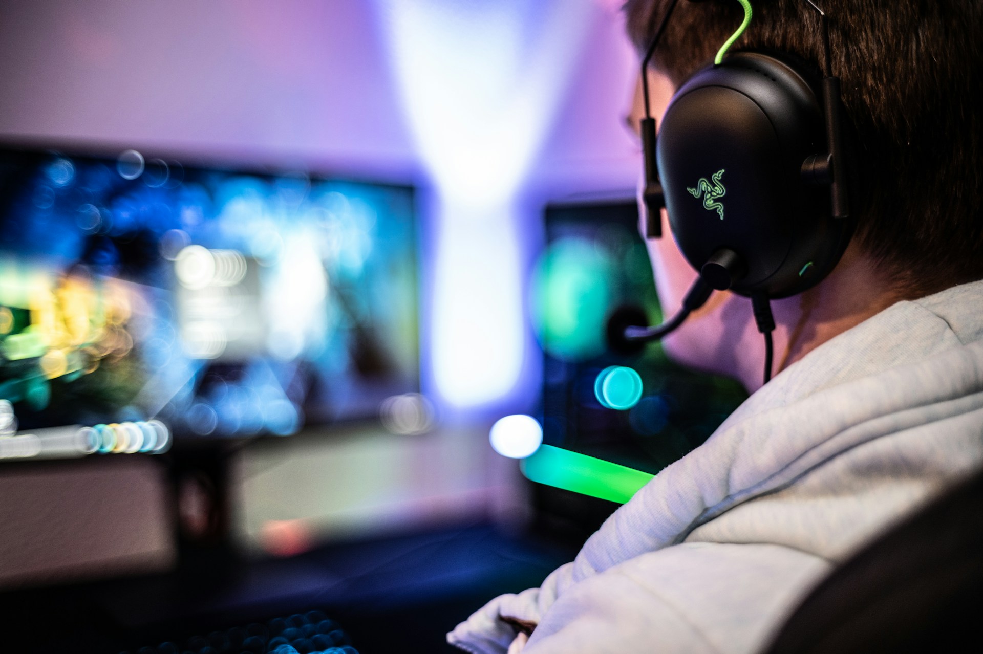 Gamer wearing headset at computer setup