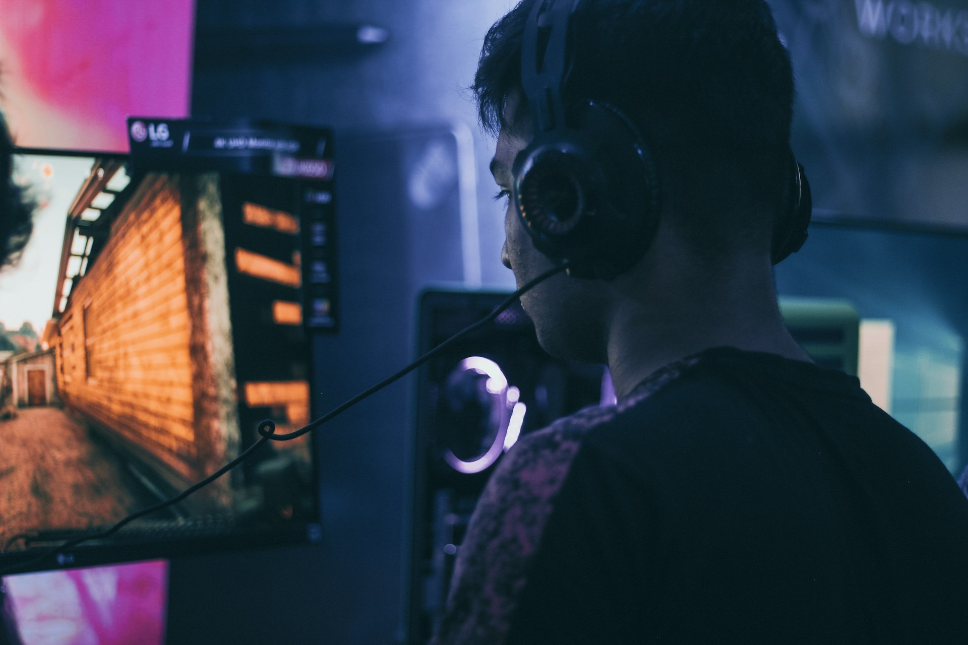 Man wearing gaming headset at desk