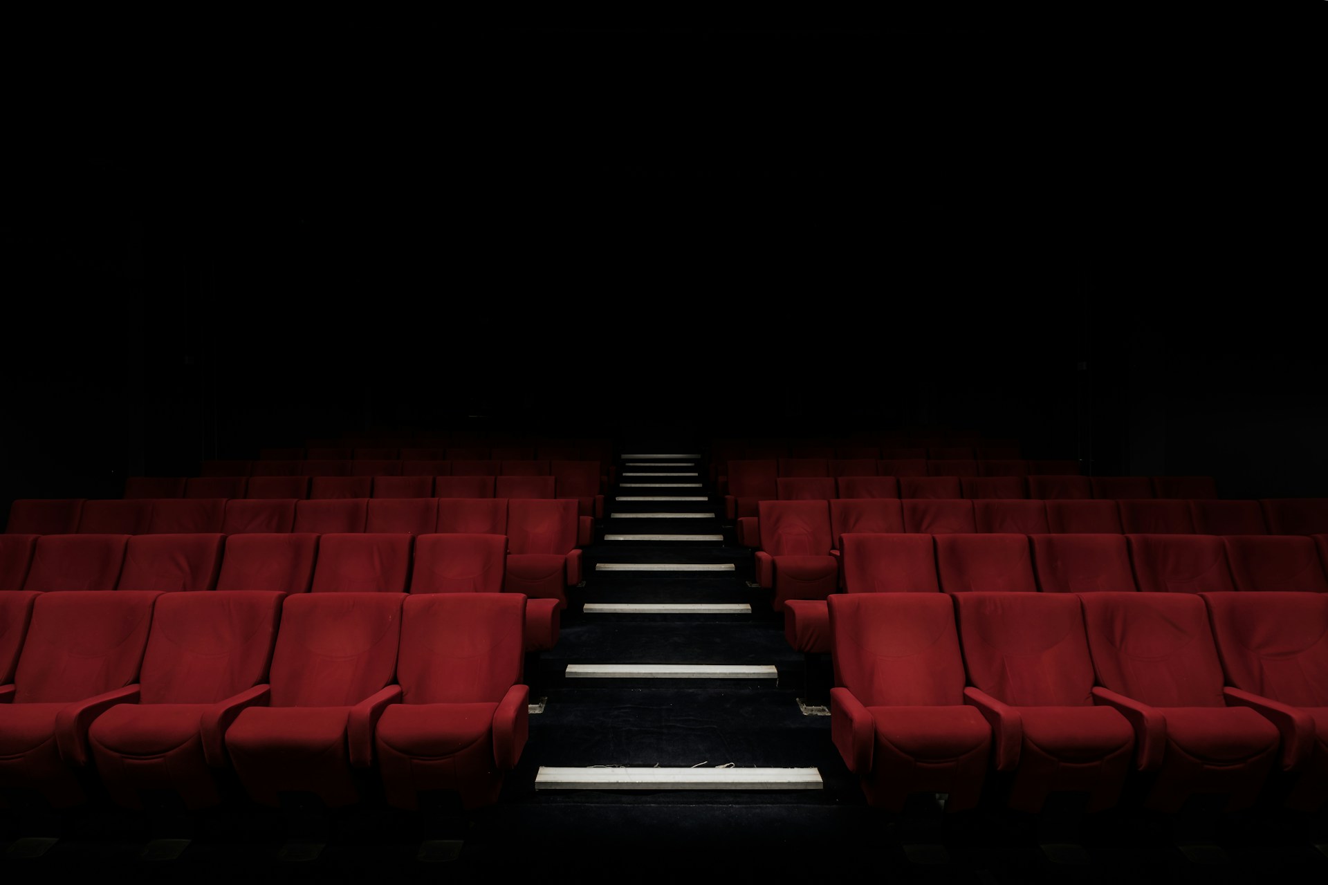 Empty movie theater with cinematic screen