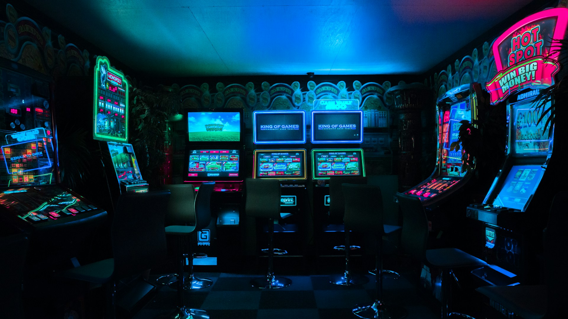 Anime-style gaming setup with colorful RGB lighting and monitors