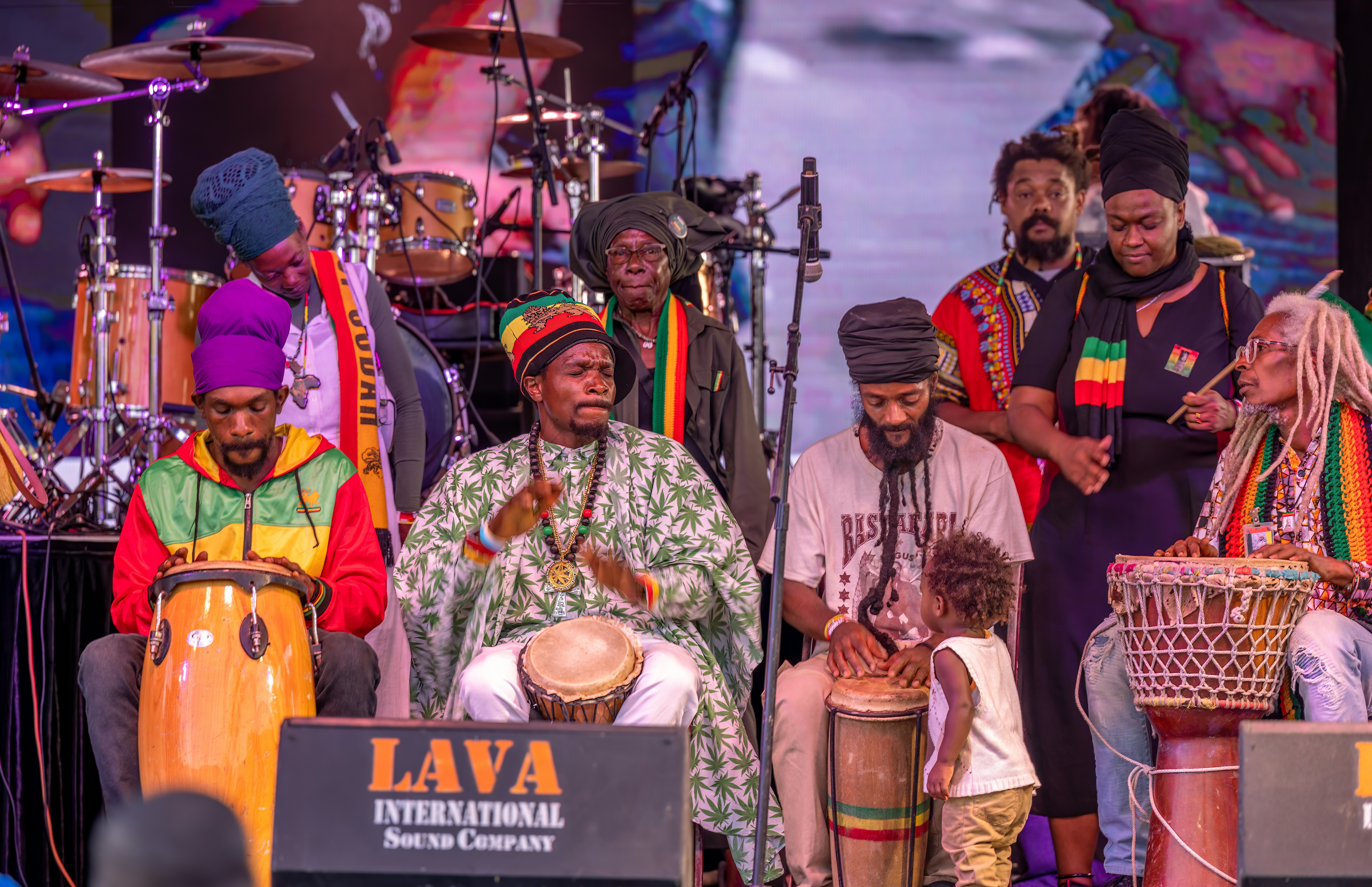 Reggae musicians performing on stage at an outdoor concert