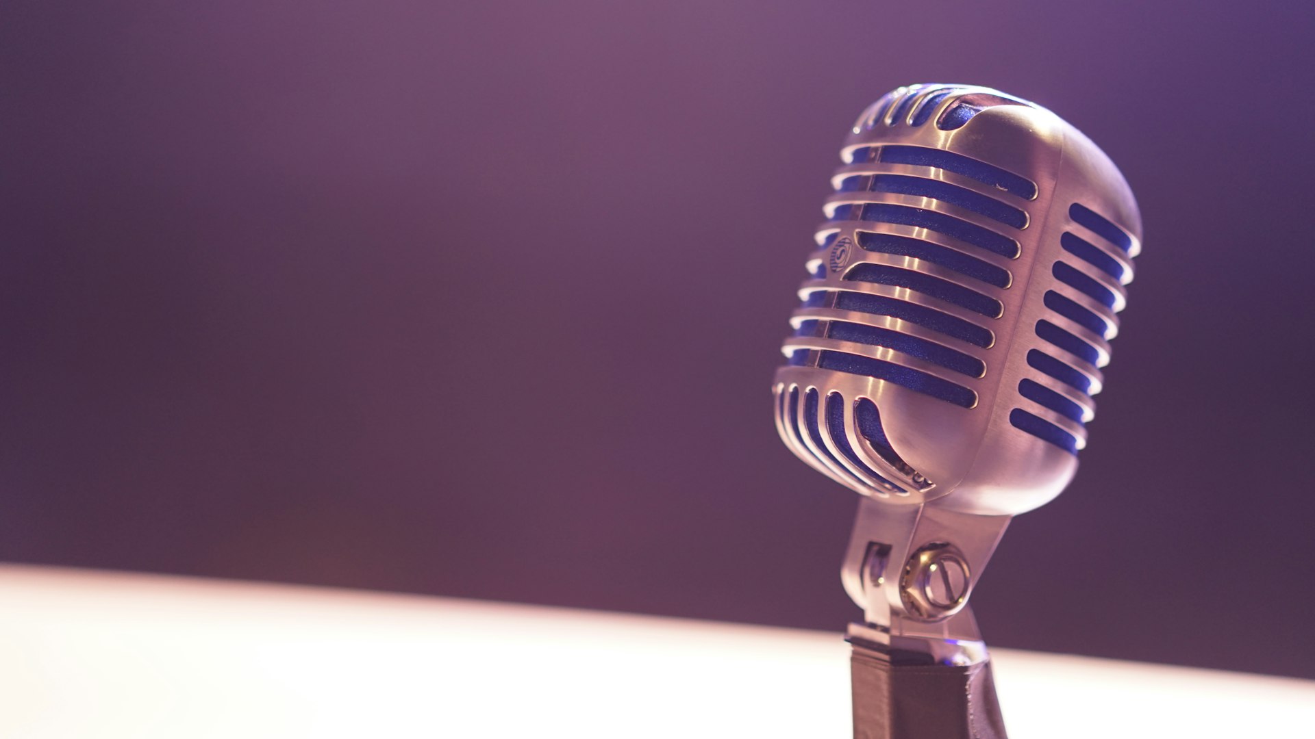 Podcast microphone on dark background for professional voice recording